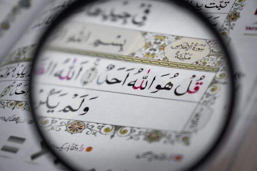 Home Detailed view of the Quran with intricate Arabic scripts, magnifying religious text and design.